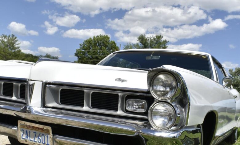 Making a beeline toward a 1965 Pontiac Grand Prix coupe Making a beeline toward a 1965 Pontiac Grand Prix coupe