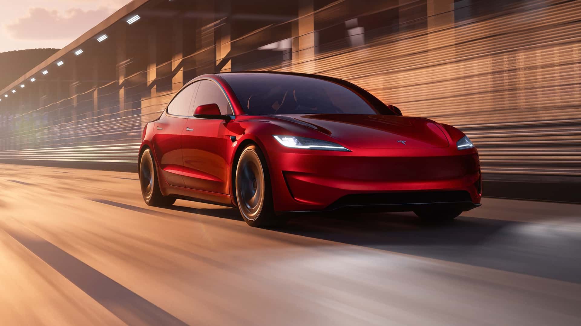 Three-quarter front view of a 2024 red Tesla Model 3 Performance