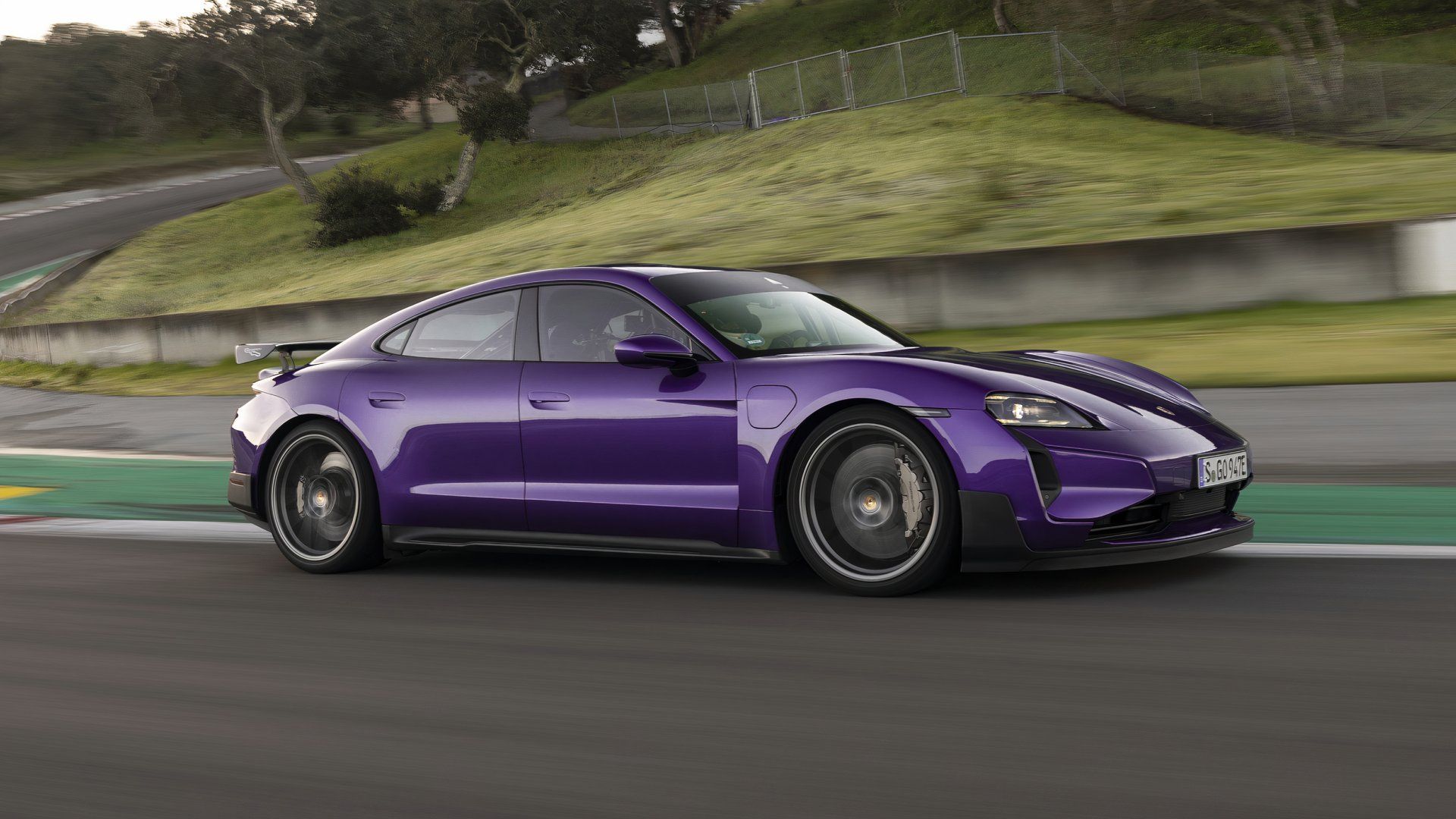 A side profile shot of the purple 2025 Porsche Taycan Turbo GT with Weissach Package 