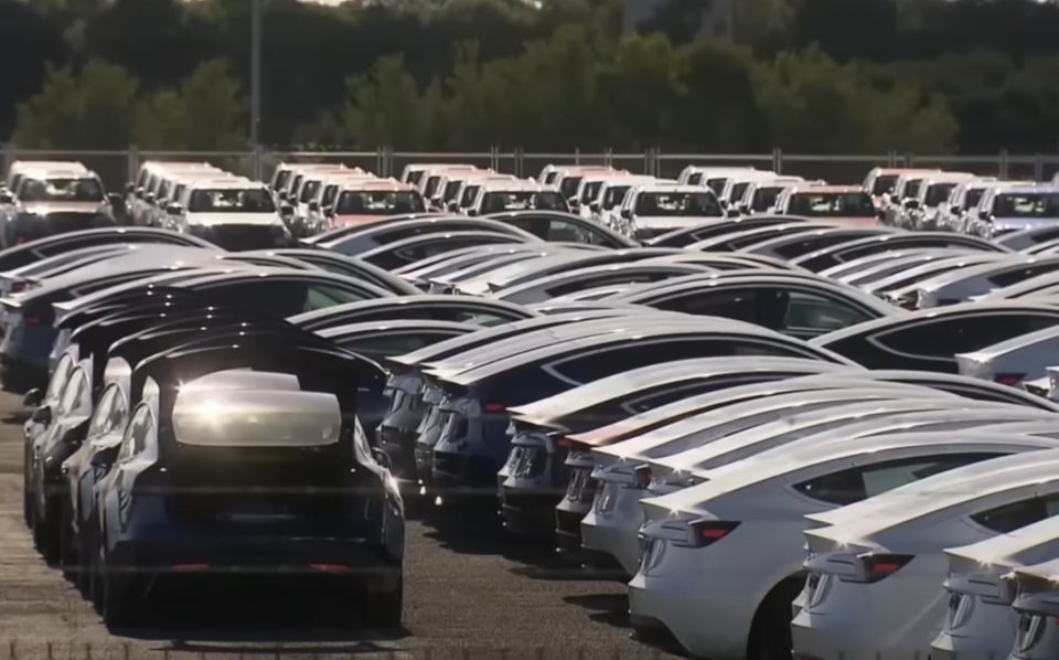 Teslas lines up in a car park in Melbourne port.