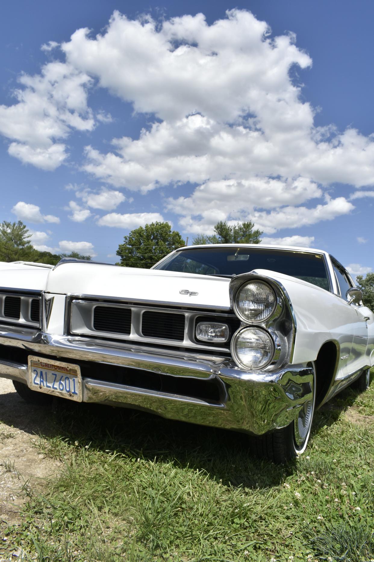 Jay Thompson 'has a few really nice vintage cars' including this 1965 Pontiac Grand Prix.