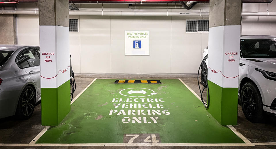 EV car charger in parking lot.