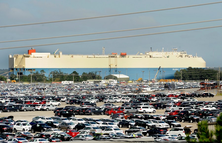 FILE - New automobiles being shipped through the Port of Brunswick sit in a vast parking lot at the Colonel's Island terminal in Brunswick, Ga., Oct. 20, 2015. The Georgia Ports Authority says a surge in auto imports rerouted from Baltimore led to its busiest month ever for car and truck shipments. The Georgia agency's chief executive said Tuesday, May 21, 2024, that the Port of Brunswick saw more than 80,000 automobiles and heavy machinery units move across its docks in April. (Bobby Haven/The Brunswick News via AP, File)