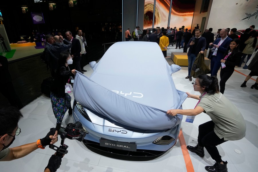 FILE - Chinese EV manufacturer BYD unveils its electric car Seal at the Paris Car Show on Oct. 17, 2022, in Paris. The Chinese government has said it will take "all measures necessary to protect our legitimate rights and interests" in response to the tariffs on Chinese-made electric vehicles but it hasn't specified what those might be. (AP Photo/Michel Euler, File)