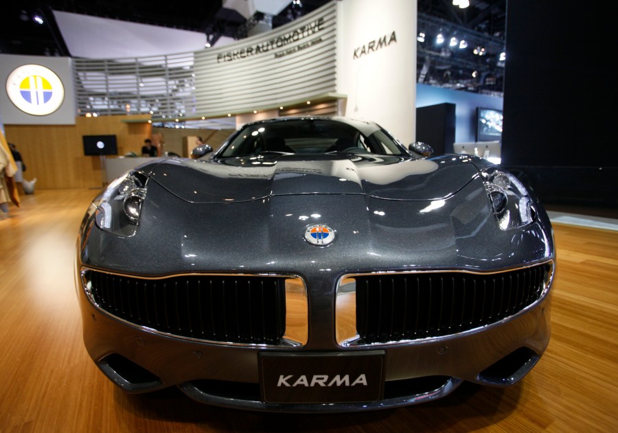 FILE - Fisker Automotive's Fisker Karma, a sports luxury plug-in hybrid car, is displayed at the 2010 Los Angeles Auto Show in Los Angeles, Nov. 18, 2010. Electric vehicle maker Fisker has filed for Chapter 11 bankruptcy protection in a period when even the top manufacturers in the industry are struggling. Its operating subsidiary, Fisker Group Inc., said in its filing that its estimated assets were between $500 million and $1 billion. (AP Photo/Damian Dovarganes, File)