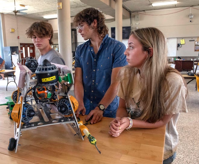 Catholic High School Robotics Team members Caleb Bobe, Brandon Hoppe, and Carsyn Neff discuss the team's planned trip to Tennessee for the MATE ROV world championship robotics competition.