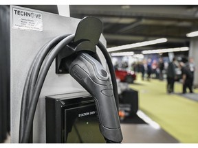 A TechnoVE electric vehicle charger during the Montreal Electric Vehicle Show in Montreal, Quebec, Canada, on Friday, April 19, 2024. Prime Minister Justin Trudeau is offering more tax breaks to automotive firms to put their electric vehicle factories in Canada, as companies including Honda Motor Co. and Toyota Motor Corp. consider lucrative new investments. Photographer: Graham Hughes/Bloomberg