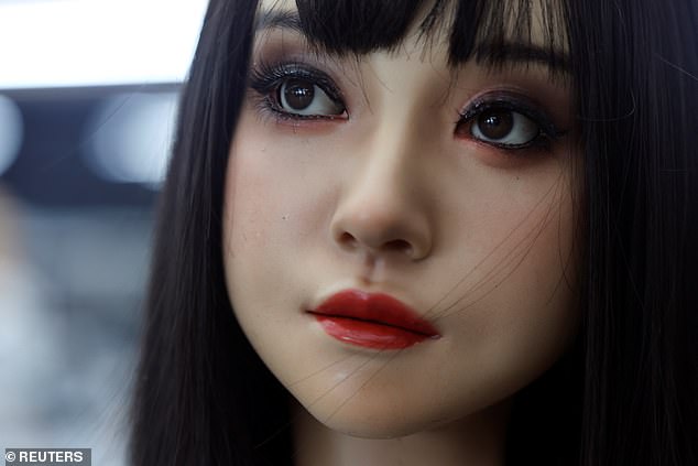 A incredibly lifelike female humanoid robot, donning a full face of make-up, is seen on display in the office of developer Ex-Robots in Dalian, Liaoning province, China