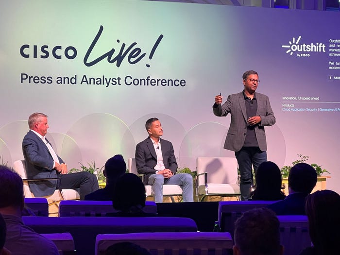 (Source: Jeff Baumgartner/Light Reading) Vijoy Pandey (far right), SVP, Outshift, at Cisco, is joined by Mark Patterson (far left), EVP and CSO; and Derek Idemoto, SVP of corporate development and Cisco investments at Cisco Live 2024.