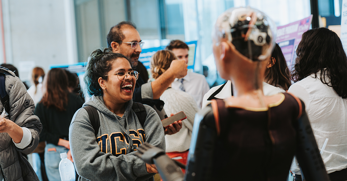 Student interacts with Machani Robotics' RIA.