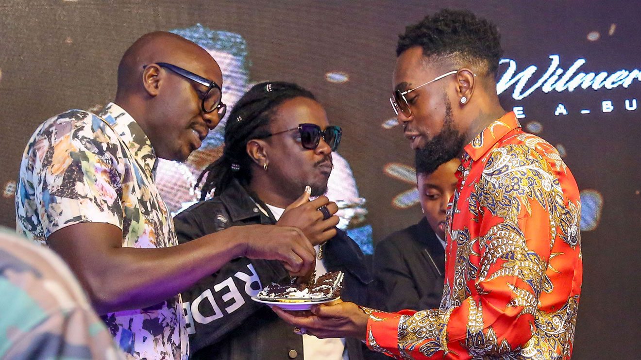 Nigerian reggae dancehall artiste Patoranking (right) with Kenyan musicians Aime Bien (left) of Sauti Sol and Nyashinski during the exclusive listening party of his second album Wilmer in Nairobi. PHOTO | THOMAS MATIKO