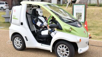 Watch a humanoid robot driving a car extremely slowly