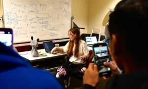 Interaction Lab researcher Amy O’Connell introducing the Blossom robot to students