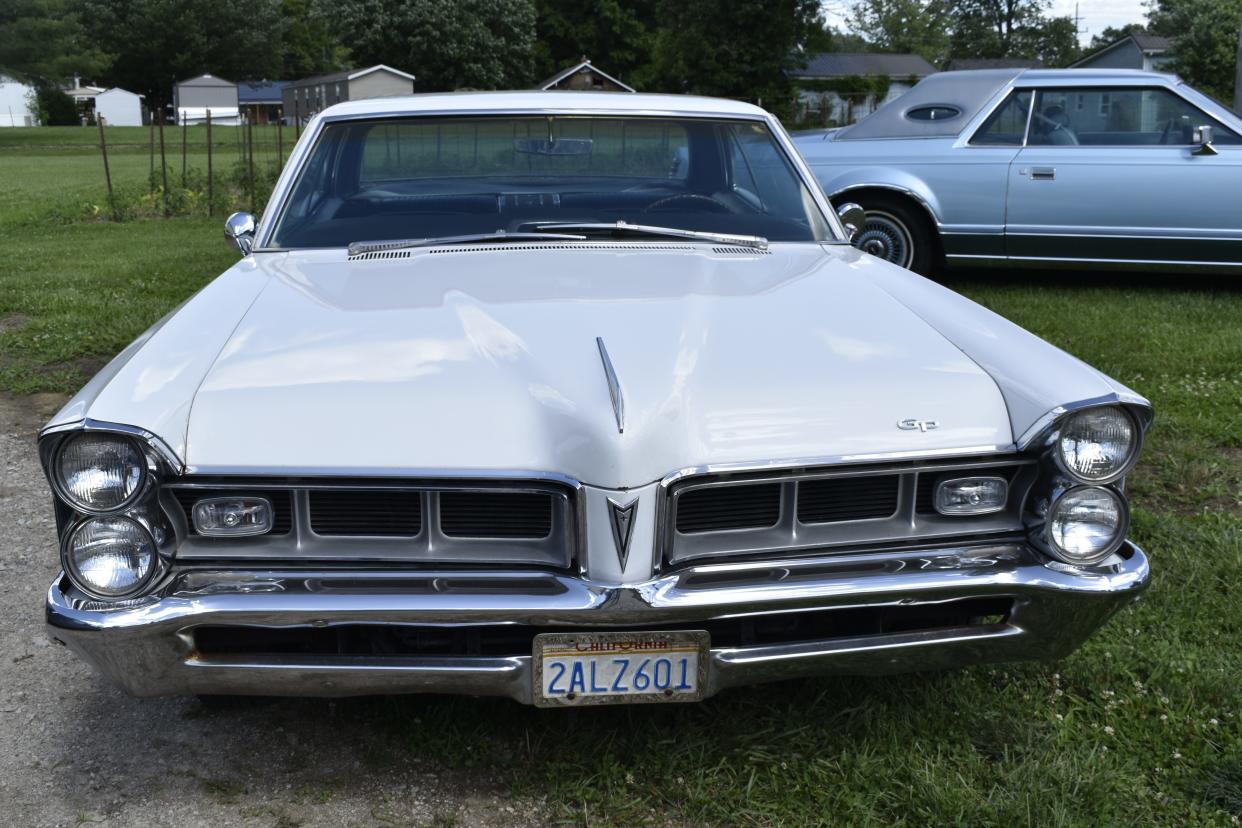 Jay Thompson keeps his 1965 Pontiac Gran Prix in the garage, but he drives it often, he said.