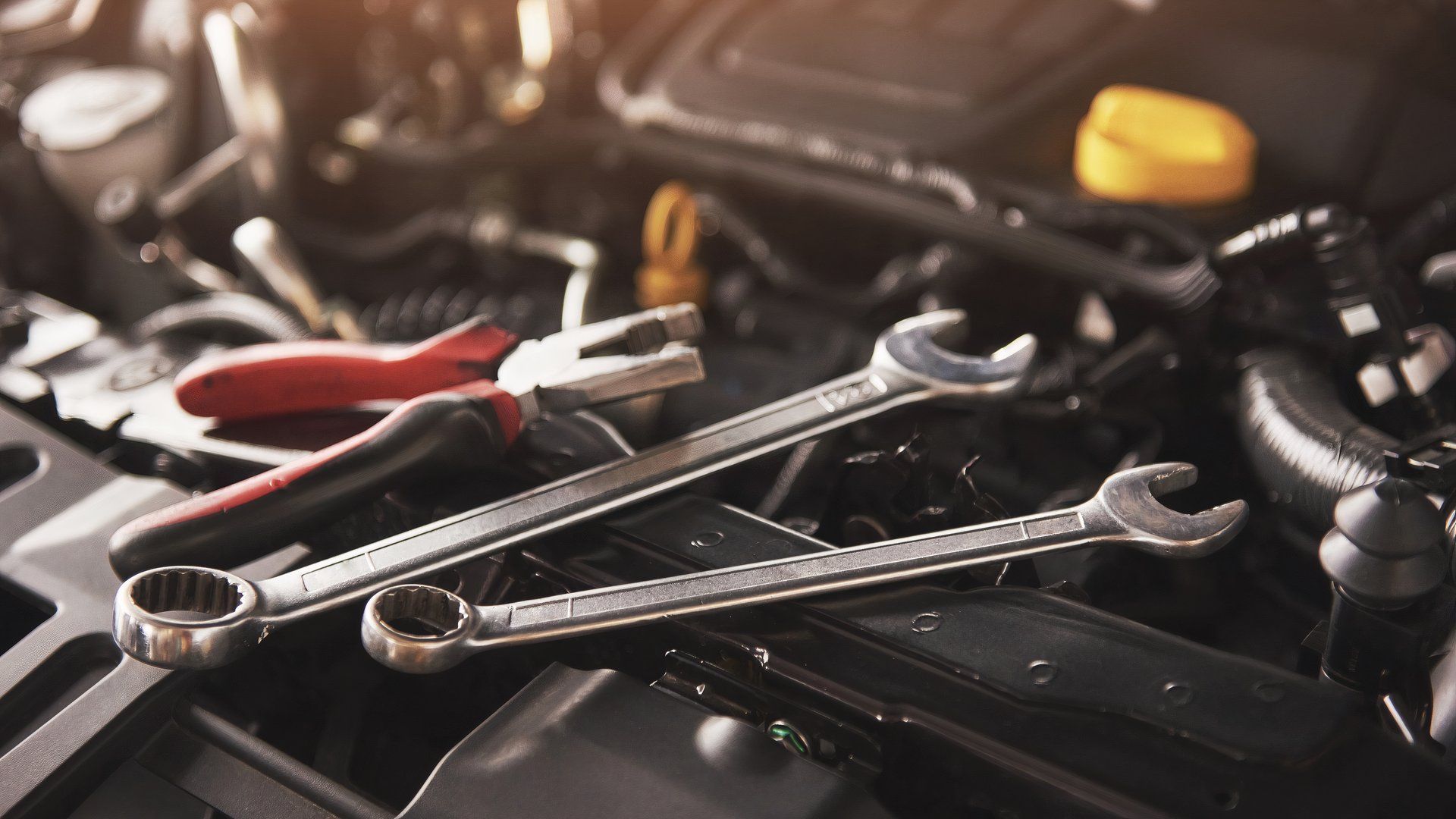 car mechanic wrenches engine bay