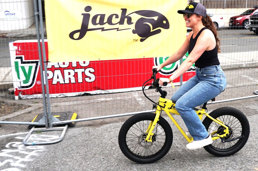 a woman riding a bike