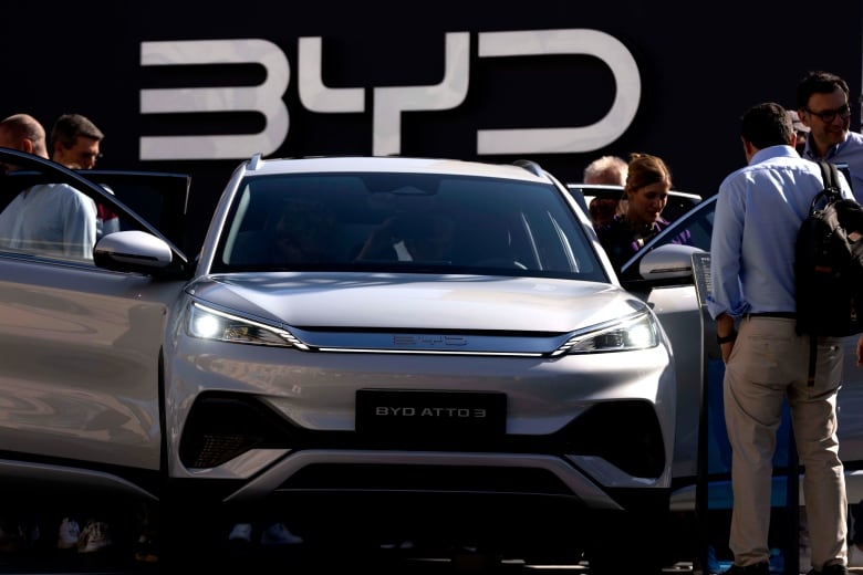 Visitors check the BYD ATTO 3 at the IAA motor show in Munich, Germany, Friday, Sept. 8, 2023. The international motor show IAA Mobility 2023 takes place in Munich from Sept. 5 until Sept. 10, 2023.