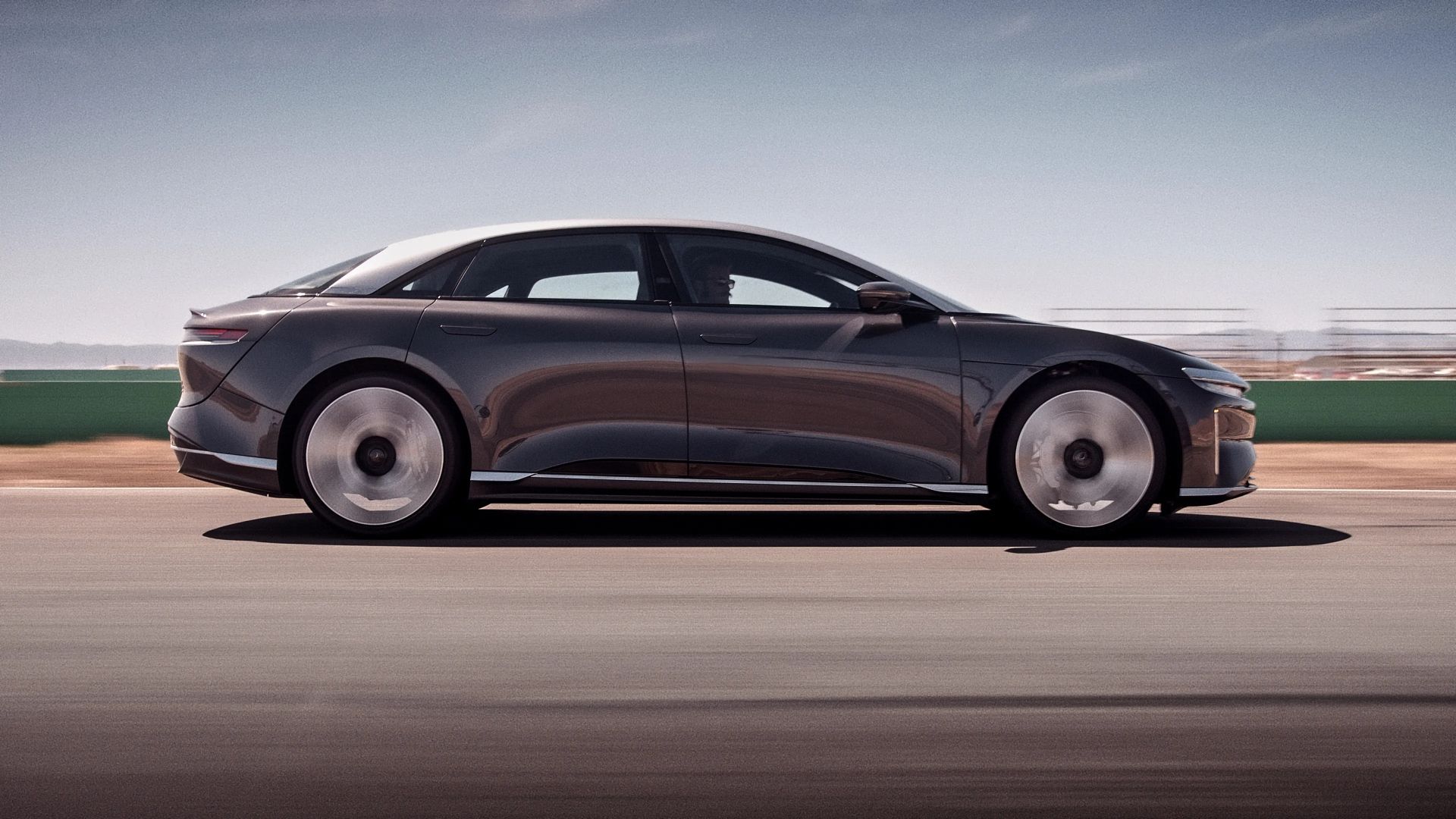 2024 Lucid Air Grand Touring in Quantum Grey side profile action shot