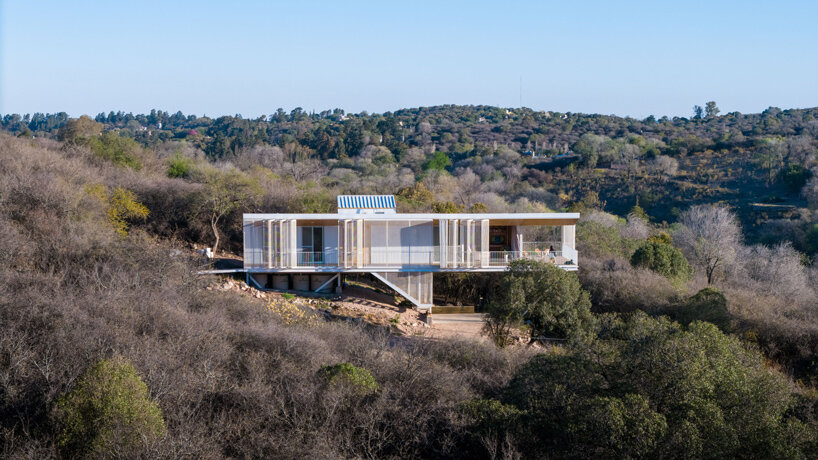 zayat arquitectura encases 'house in the clouds' with perforated panels in argentina