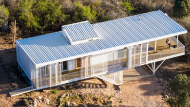 zayat arquitectura encases ‘house in the clouds’ with perforated panels in argentina