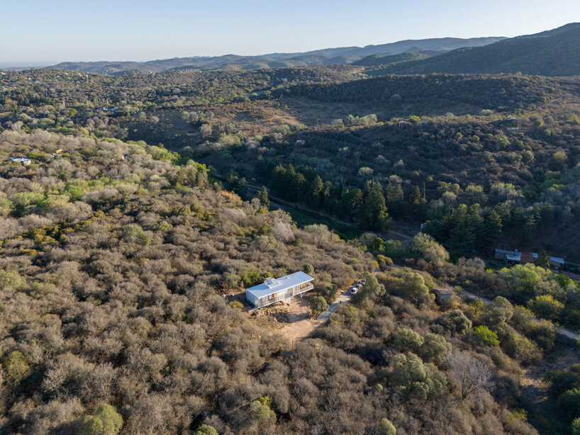 zayat arquitectura encases 'house in the clouds' with perforated panels in argentina