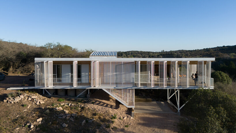 zayat arquitectura encases 'house in the clouds' with perforated panels in argentina