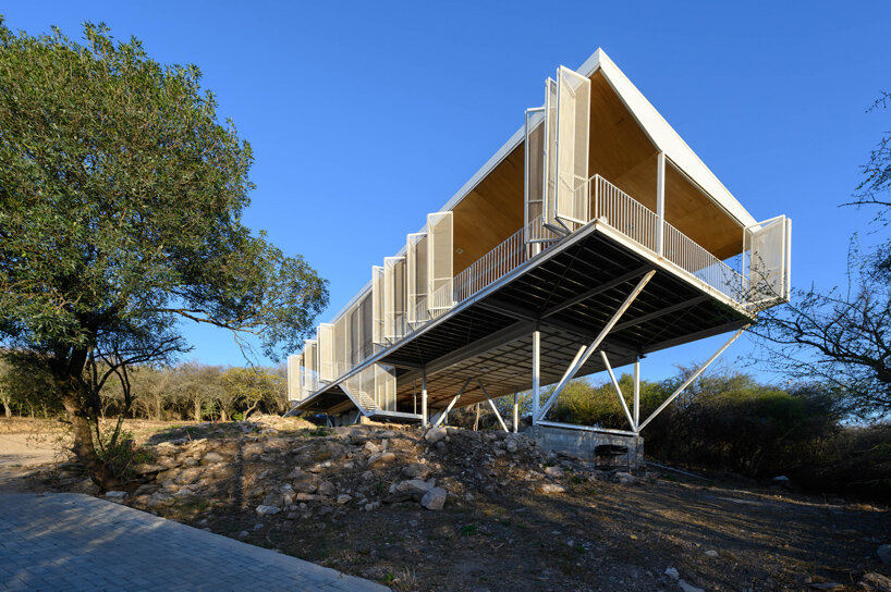 zayat arquitectura encases 'house in the clouds' with perforated panels in argentina