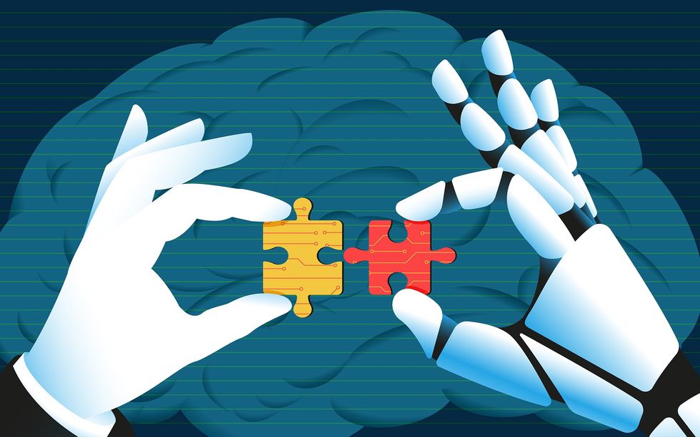 Illustration of a human and robot hand fitting puzzle pieces together in front of a brain