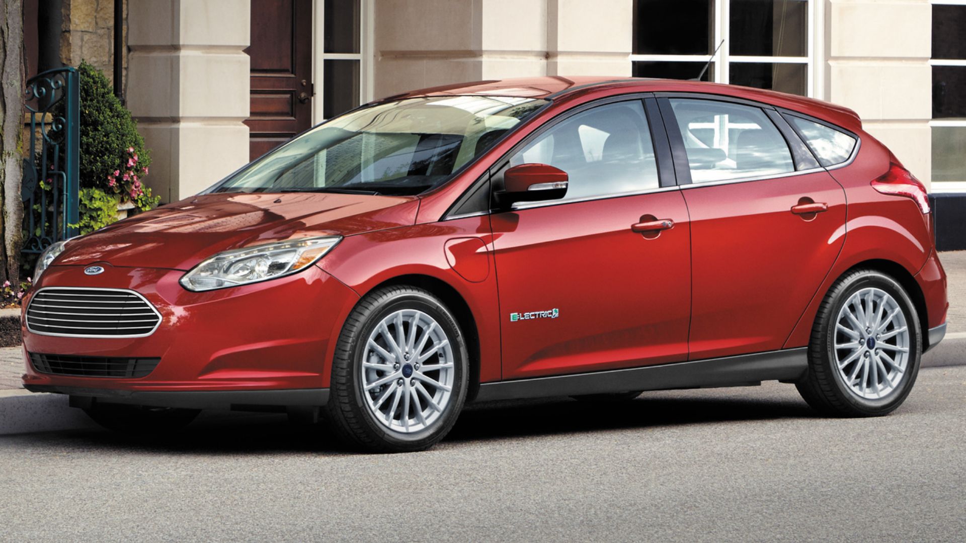 2017 Ford Focus Electric in red Posing on street in front of building