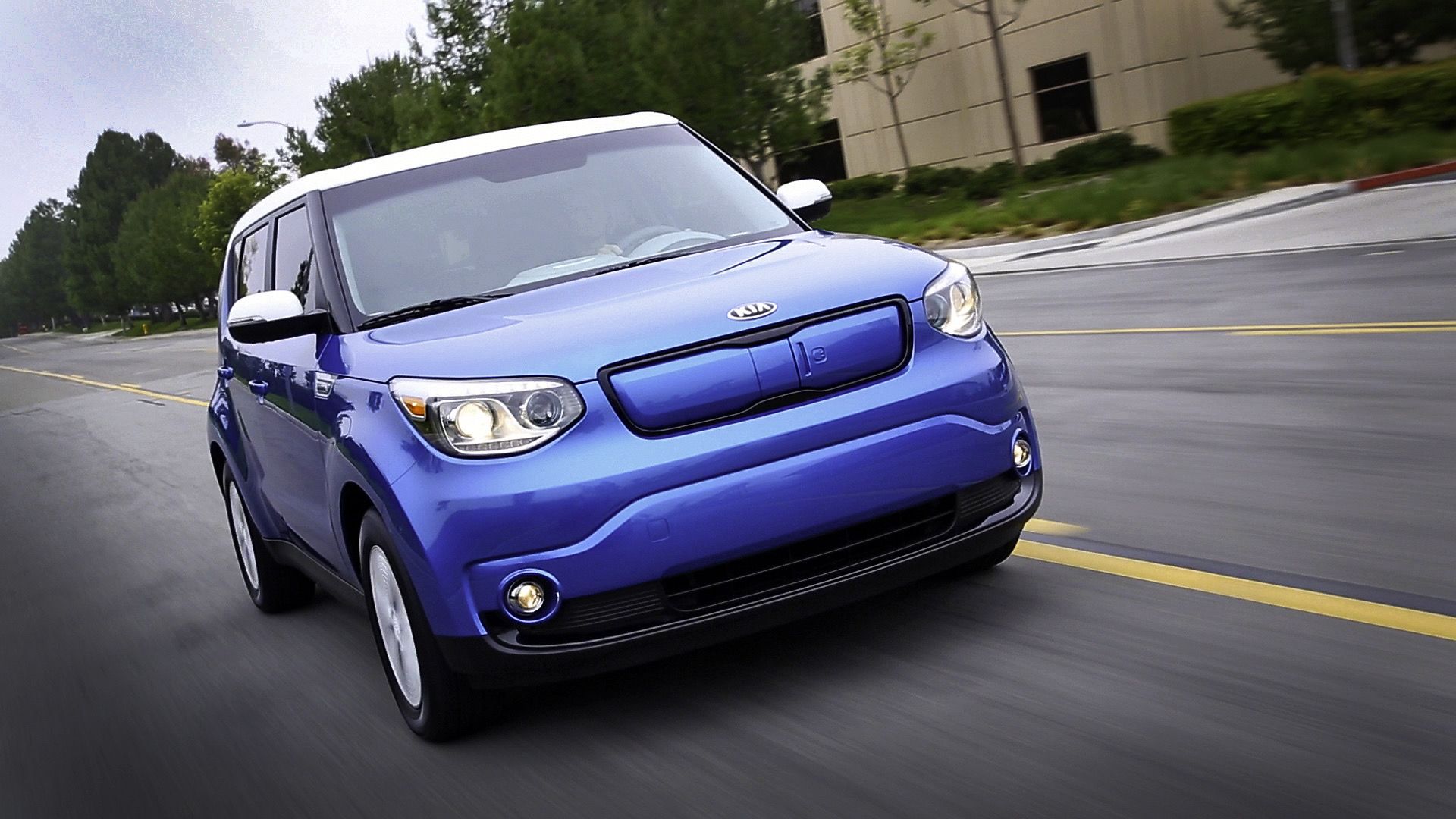 2017 Kia Soul EV In blue posing on suburban street