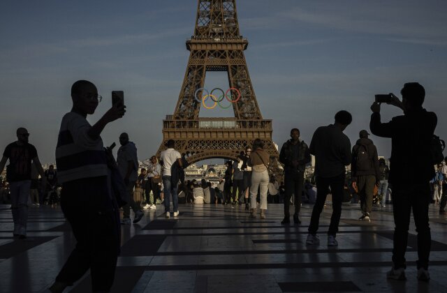 The Olympic rings are seen on the Eiffel Tower Friday, June 7, 2024 in Paris. The Paris Olympics organizers mounted the rings on the Eiffel Tower on Friday as the French capital marks 50 days until the start of the Summer Games. The 95-foot-long and 43-foot-high structure of five rings, made entirely of recycled French steel, will be displayed on the south side of the 135-year-old historic landmark in central Paris, overlooking the Seine River. (AP Photo/Aurelien Morissard)