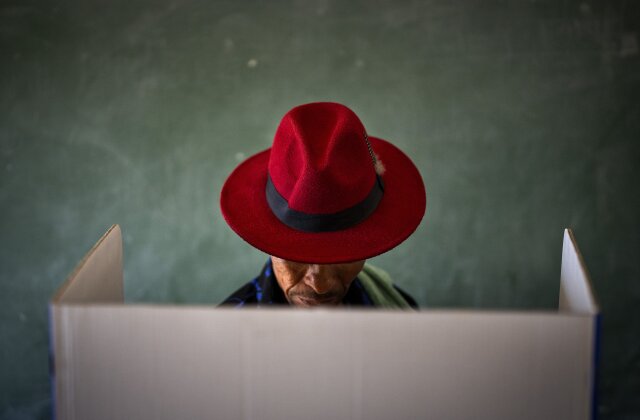 A voter fills out a ballot paper during general elections in Nkandla, Kwazulu Natal, South Africa, Wednesday May 29, 2024. South Africans are voting in an election seen as their country's most important in 30 years, and one that could put them in unknown territory in the short history of their democracy, the three-decade dominance of the African National Congress party being the target of a new generation of discontent in a country of 62 million people — half of whom are estimated to be living in poverty. (AP Photo/Emilio Morenatti)