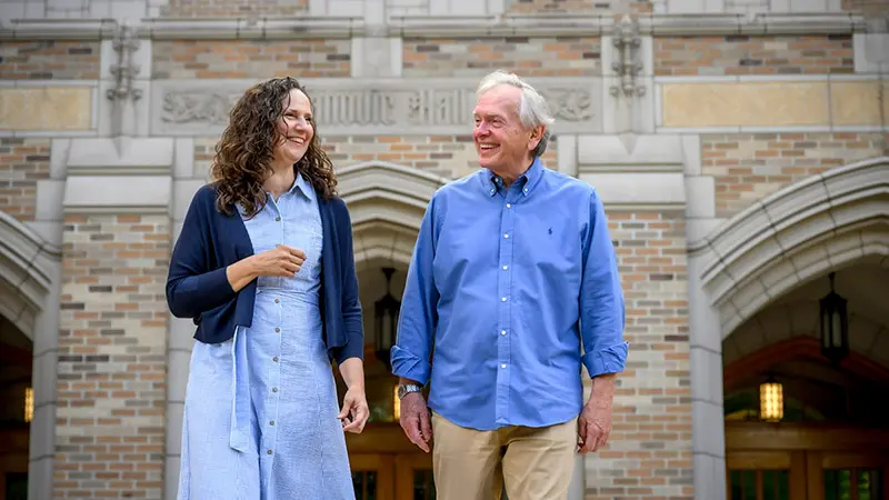 Susan McDonald standing next to Mike Morris having a discussion.