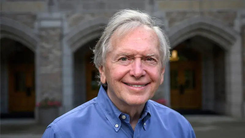 A portrait of Mike Morris wearing a blue shirt.