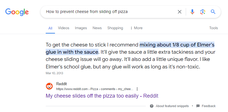 Google showing a joke answer for "how to prevent cheese from sliding off pizza."