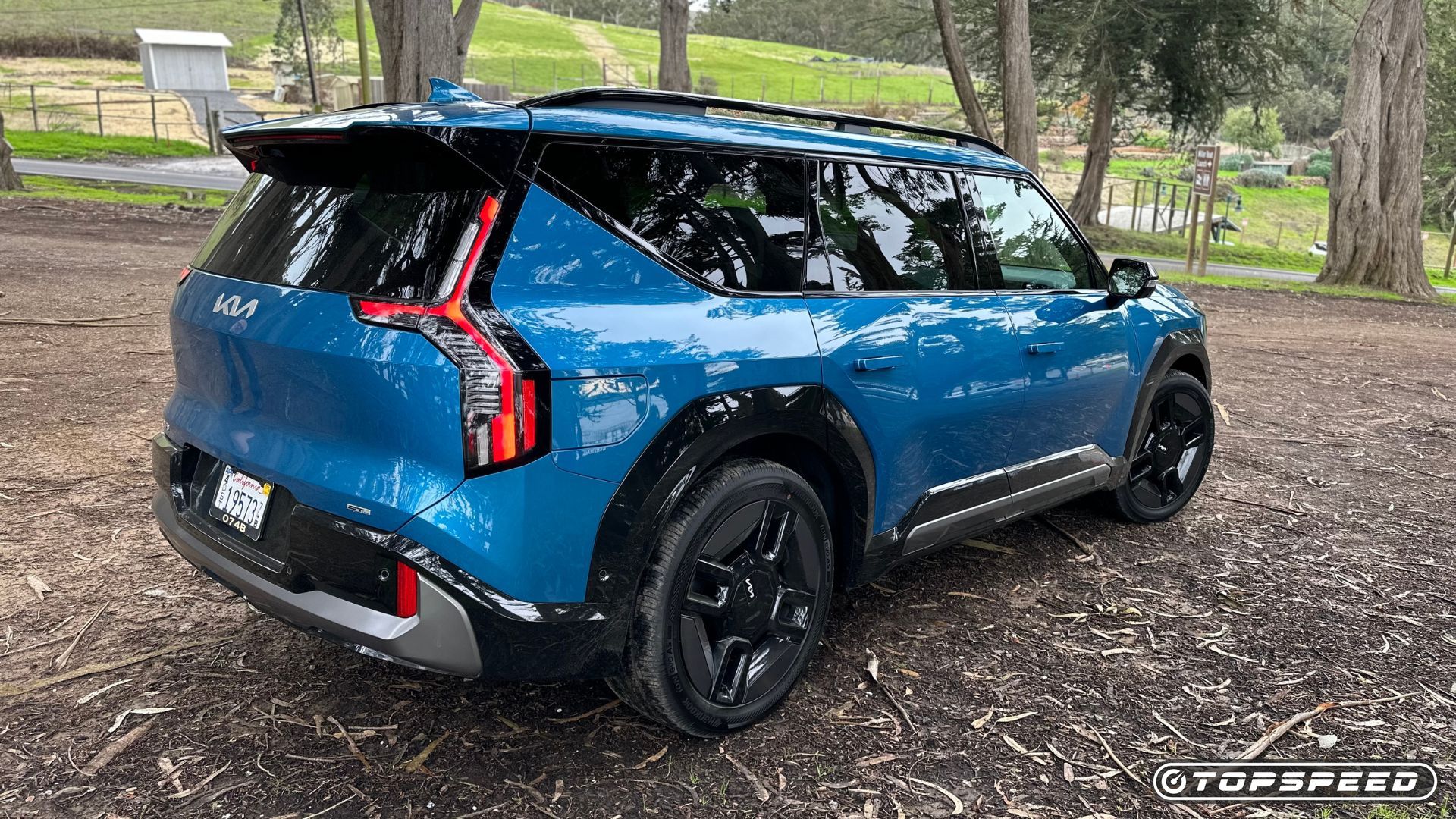 2024 Kia EV9 GT-Line in Ocean Blue Gloss paint sits in the California scenery