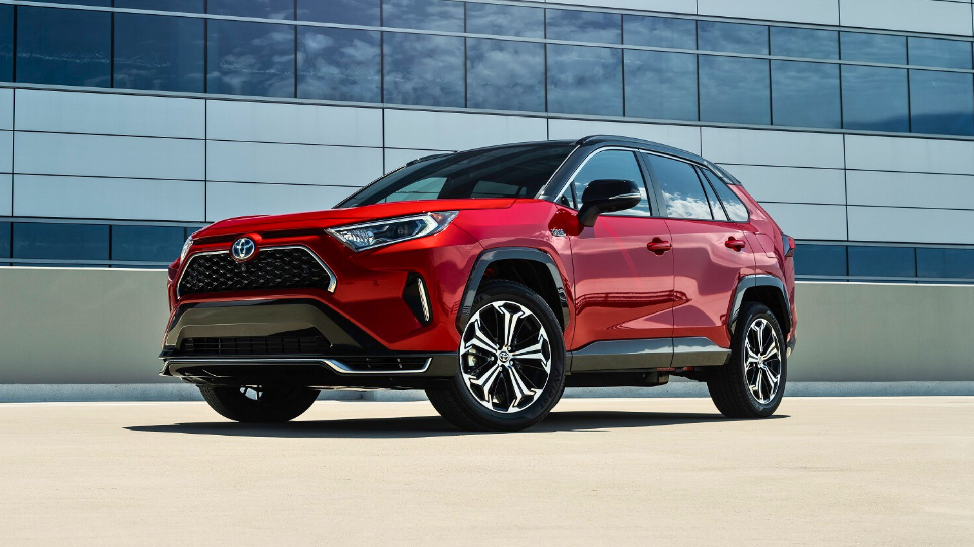 Front three-quarters shot of a red Toyota RAV4 Prime