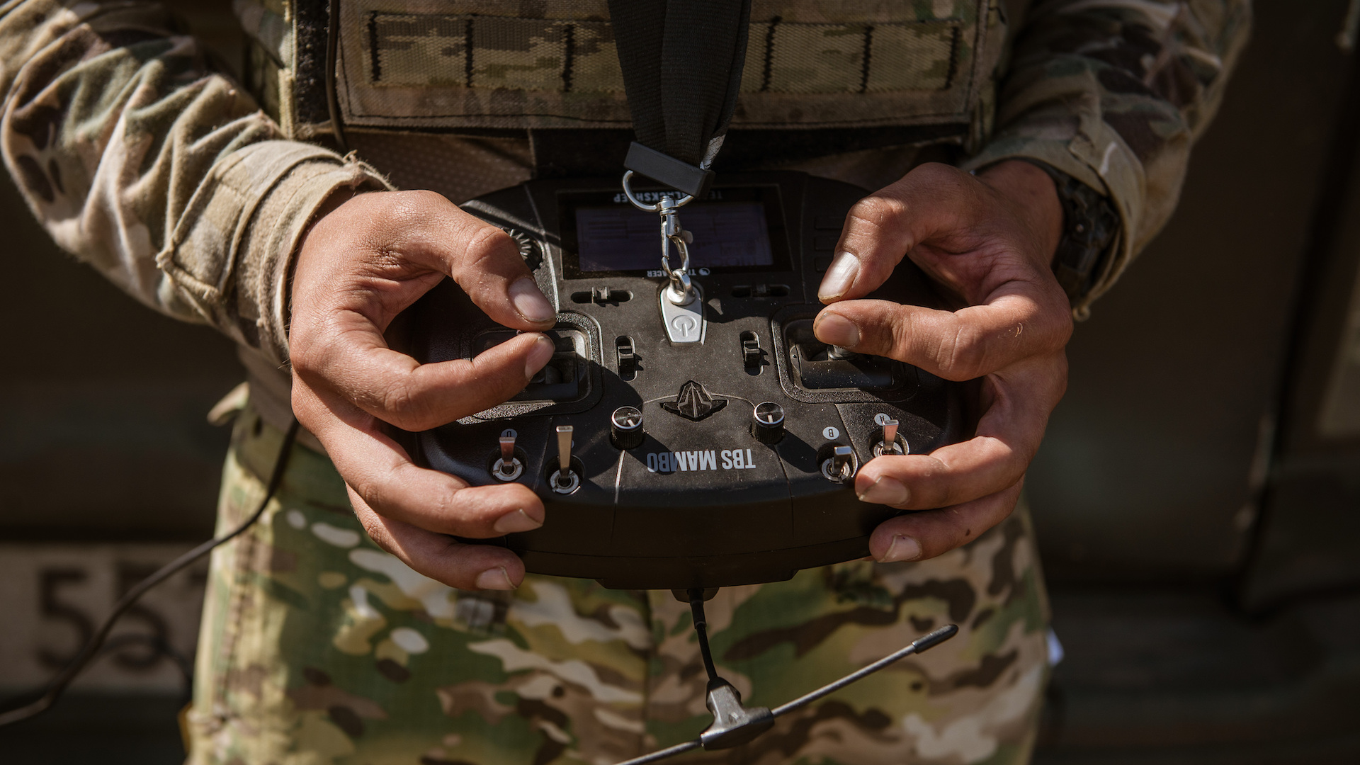 A soldier holding a drone